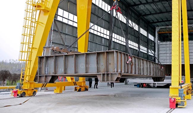 Gantry Crane lifting a large steel structure during fabrication