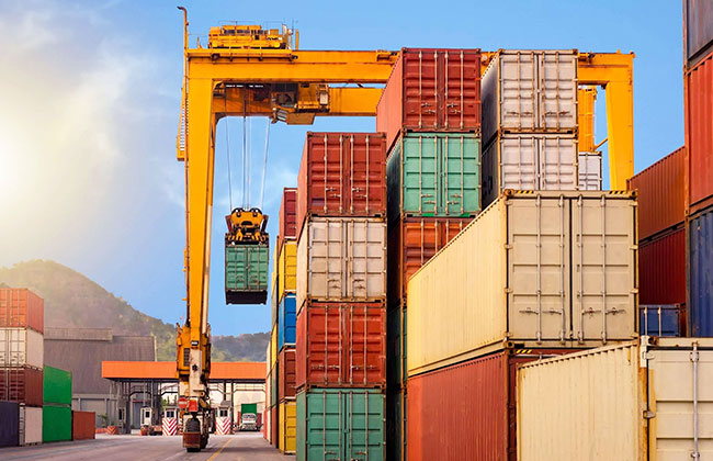 RTG crane stacking containers in a yard