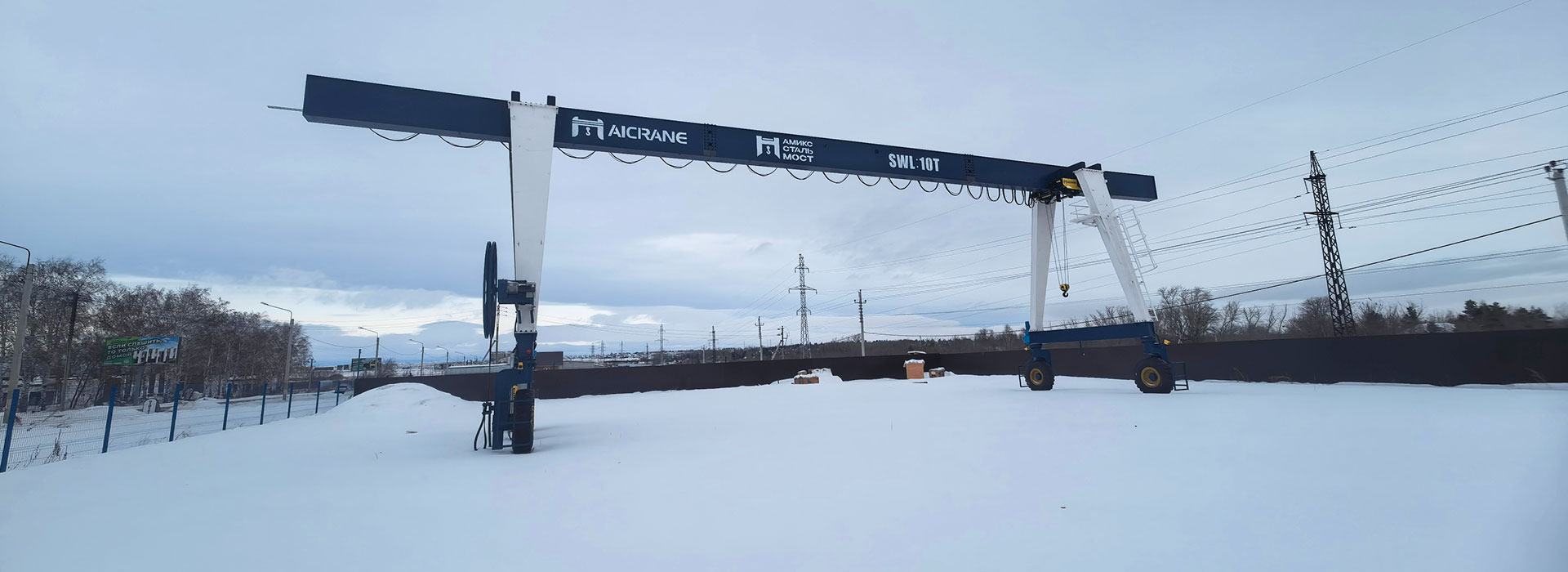 RTG crane operating in snowy conditions during mobile operations