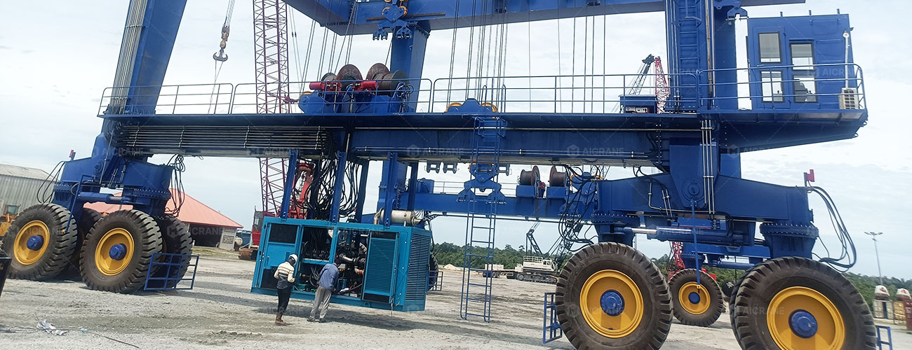 Travellift troubleshooting and on-site maintenance in progress at a shipyard