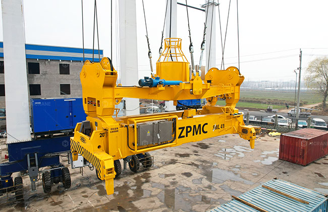 Container spreader with anti-sway control