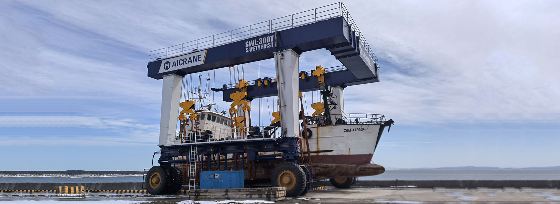 Heavy-duty boat travel lift handling a fishing boat at a marina