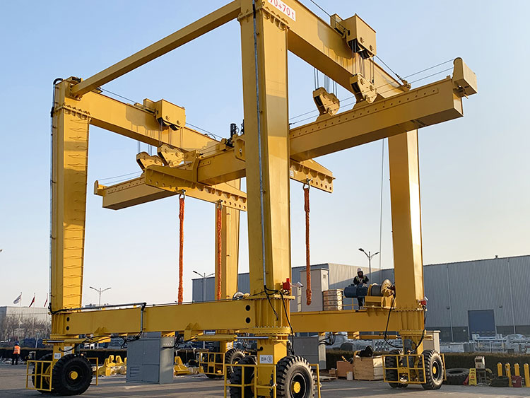 Precast girder handling in storage yard with RTG crane and adjustable spreader beam