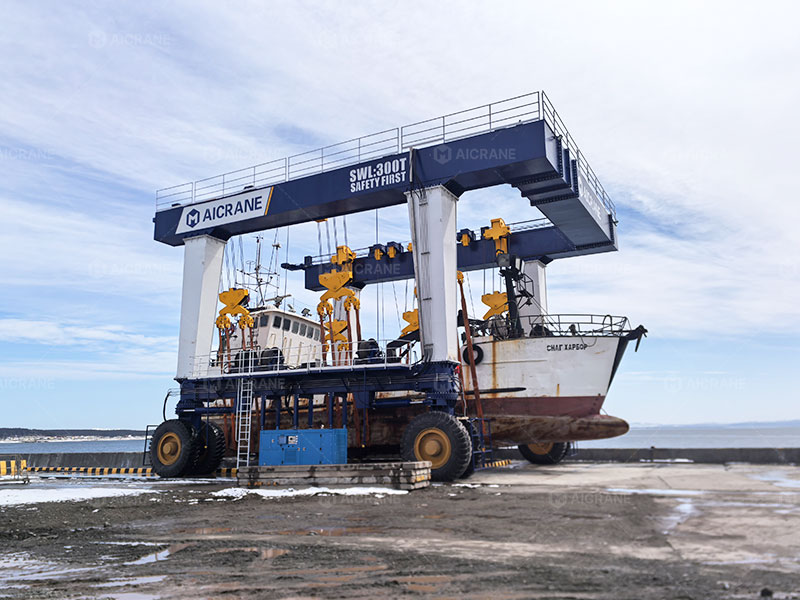 Heavy-duty boat travel lift handling a fishing boat at a marina