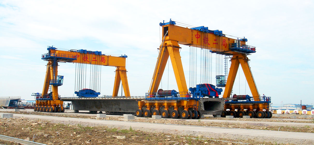 RTG crane handling precast concrete beams and bridge girders in a production yard