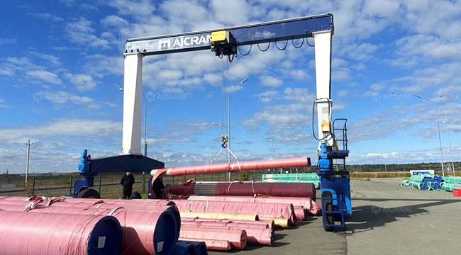 rubber tired gantry crane operating in a steel yard
