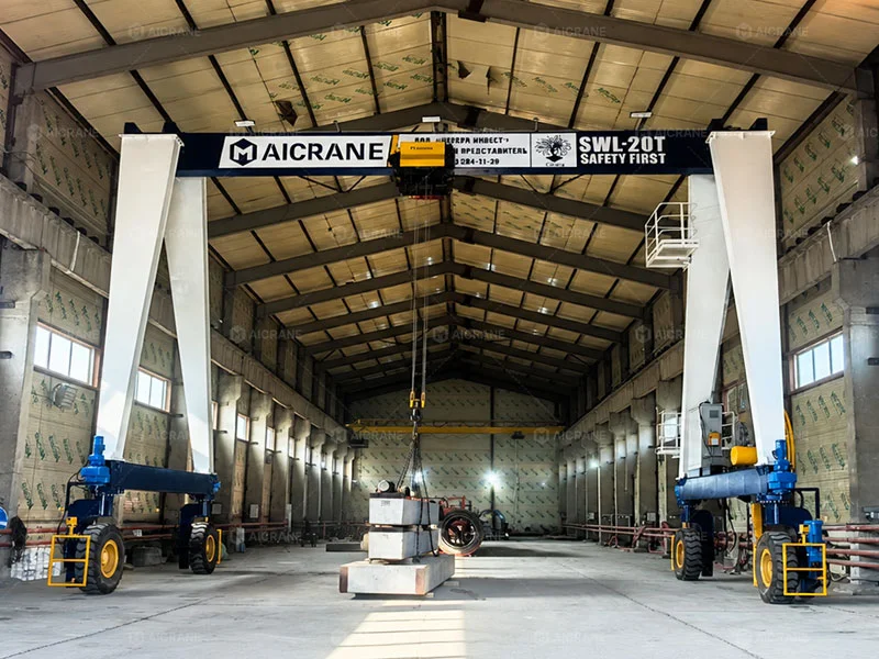 Indoor rubber tyred gantry crane operating in a manufacturing workshop
