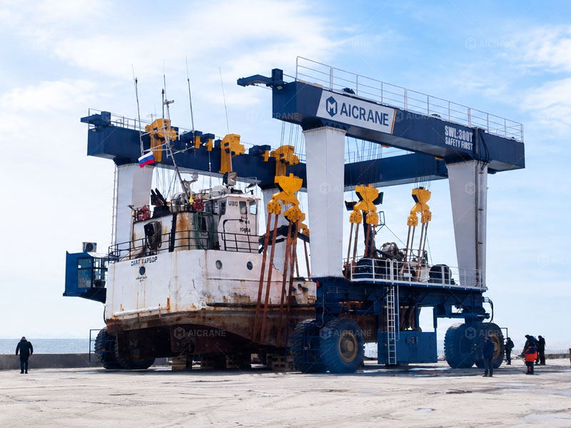 Mobile Boat Hoist Lifting A Vessel At a Marina