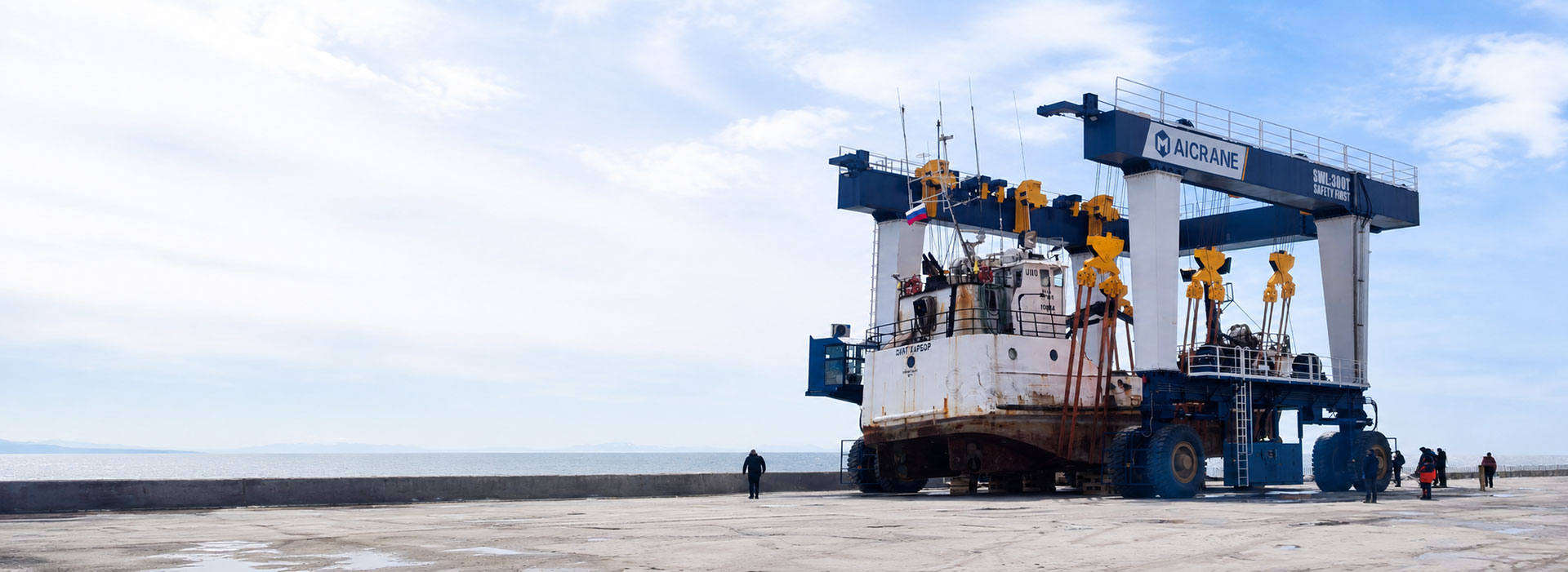 Mobile Boat Hoist Lifting A Vessel At a Marina