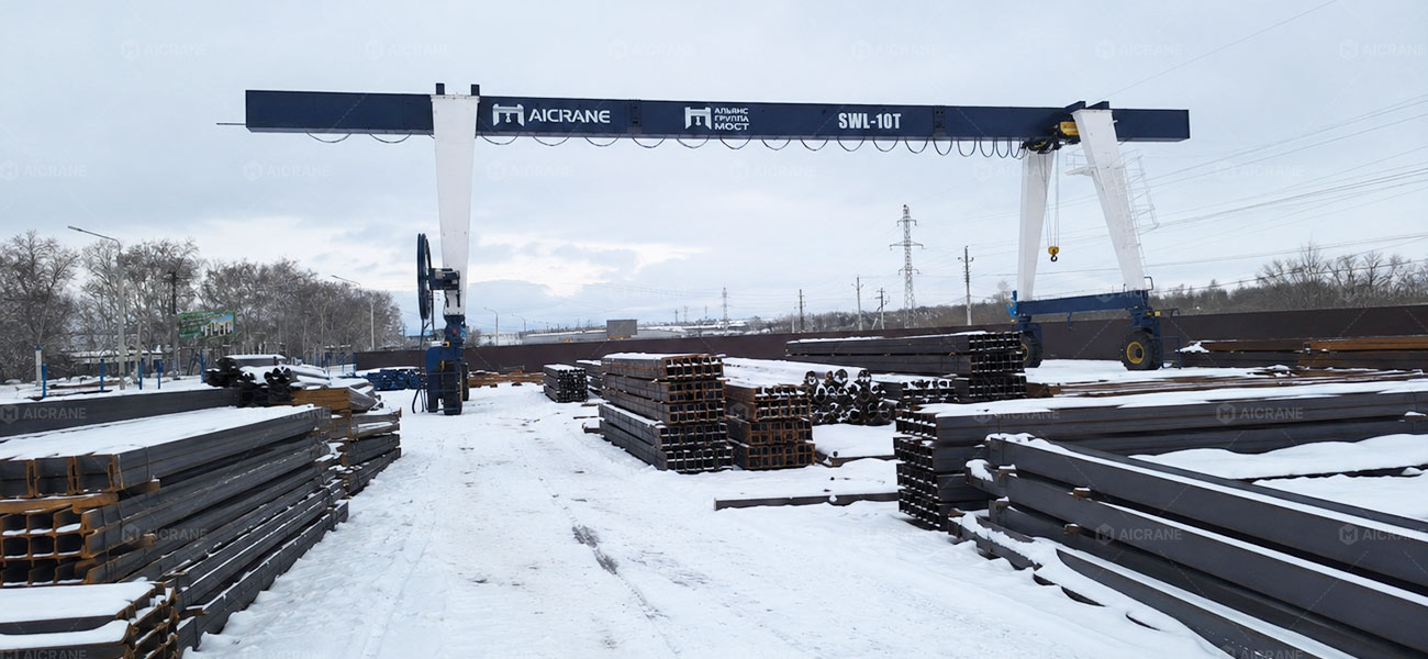 RTG crane handling steel beams in steel processing yard