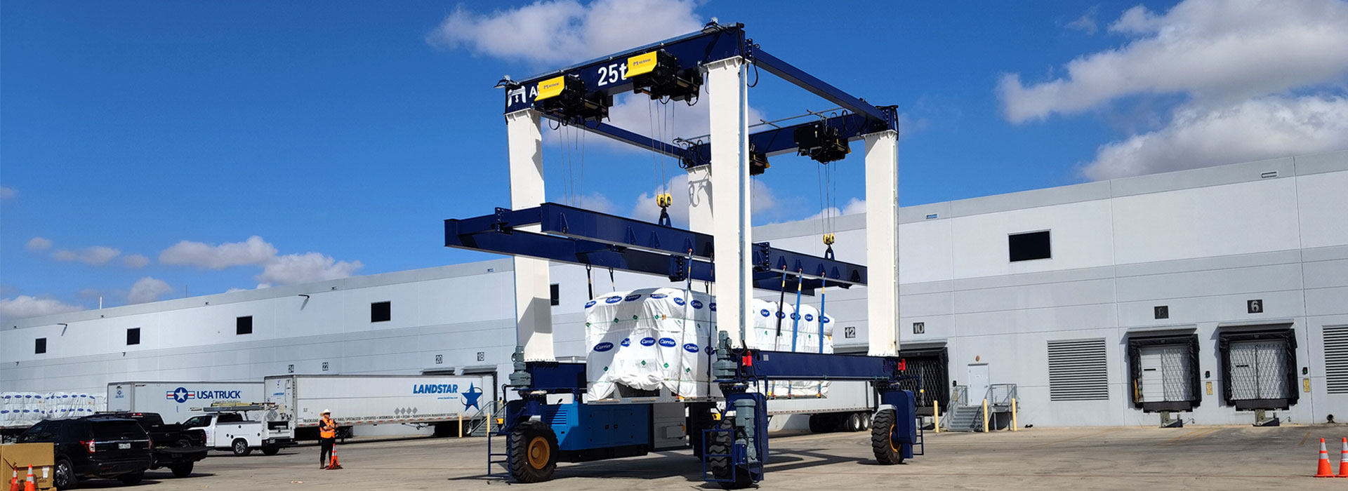 RTG rubber tyred gantry crane lifting cargo in industrial warehouse yard