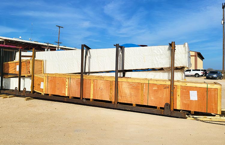 Disassembled crane components for international transportation