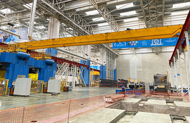 Frequency controlled overhead crane for high frequency material handling in a production workshop