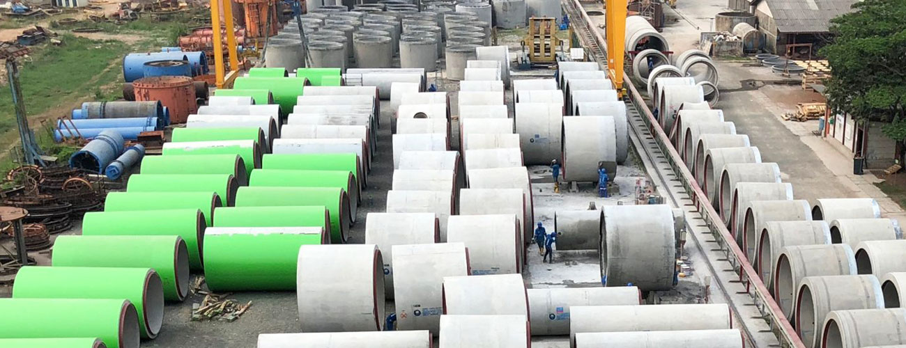 Indonesian precast concrete production yard with large concrete elements for infrastructure construction