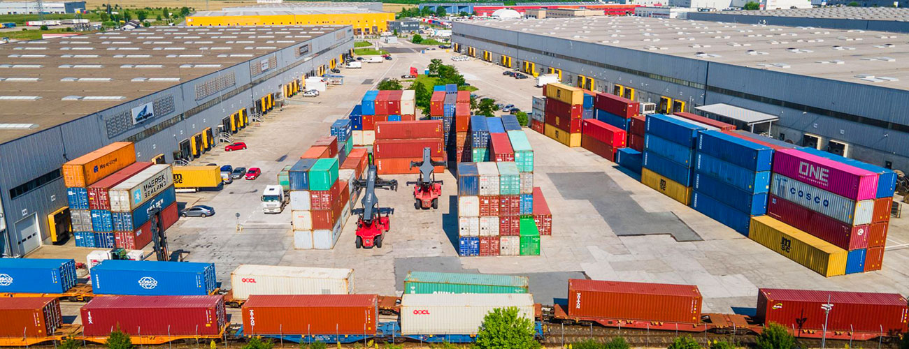Inland logistics hub connecting container yards, trucks, warehouses, and regional distribution networks