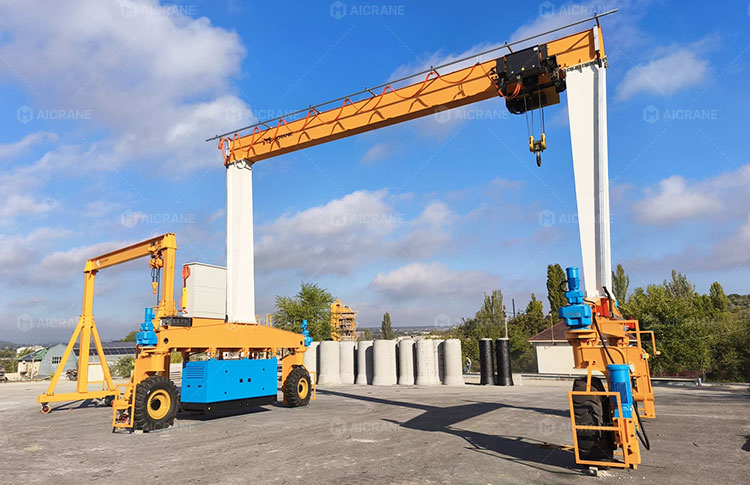 Mobile rubber tyred gantry crane transferring precast elements between storage and loading areas