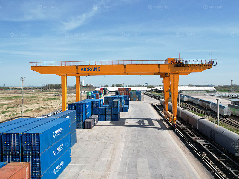 Rail mounted gantry crane handling containers in a fixed terminal yard