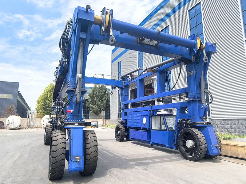 SC80 Electric Straddle Carrier Handling Heavy Cargo