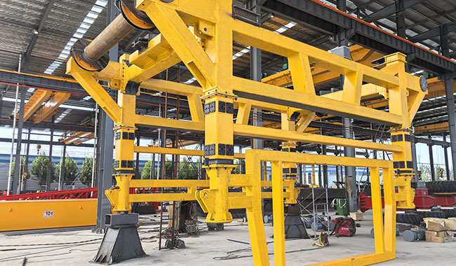 Straddle carrier frame designed for operation through facilities with limited door clearance