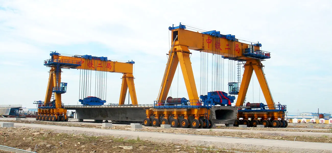 YTL hydraulic rubber tyred gantry crane handling precast box girders across a concrete yard
